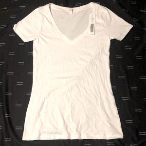 Brand new, never worn v-neck white tee. Size L.
